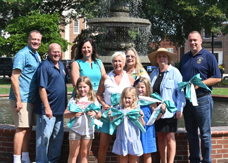 Shown in back are (l-r) Robert Geist; Bill West, mayor of Georgetown; Rep. Valerie Jones Giltner, R-Georgetown; candidate for lieutenant governor Ruth Briggs King; Sheri Long; Maria Evans, executive director of the Crisis House; and Sen. Brian Pettyjohn, R-Georgetown. In front are Lexi King, 8; Sawyer King, 6; and Victoria King, 8.